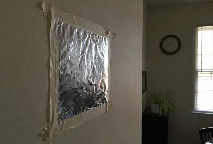 People Are Taping Aluminium Foil To Their Walls