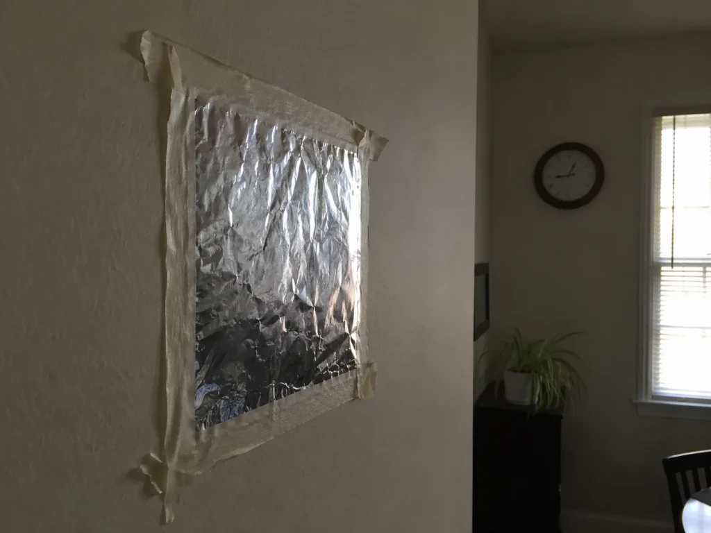 People Are Taping Aluminium Foil To Their Walls